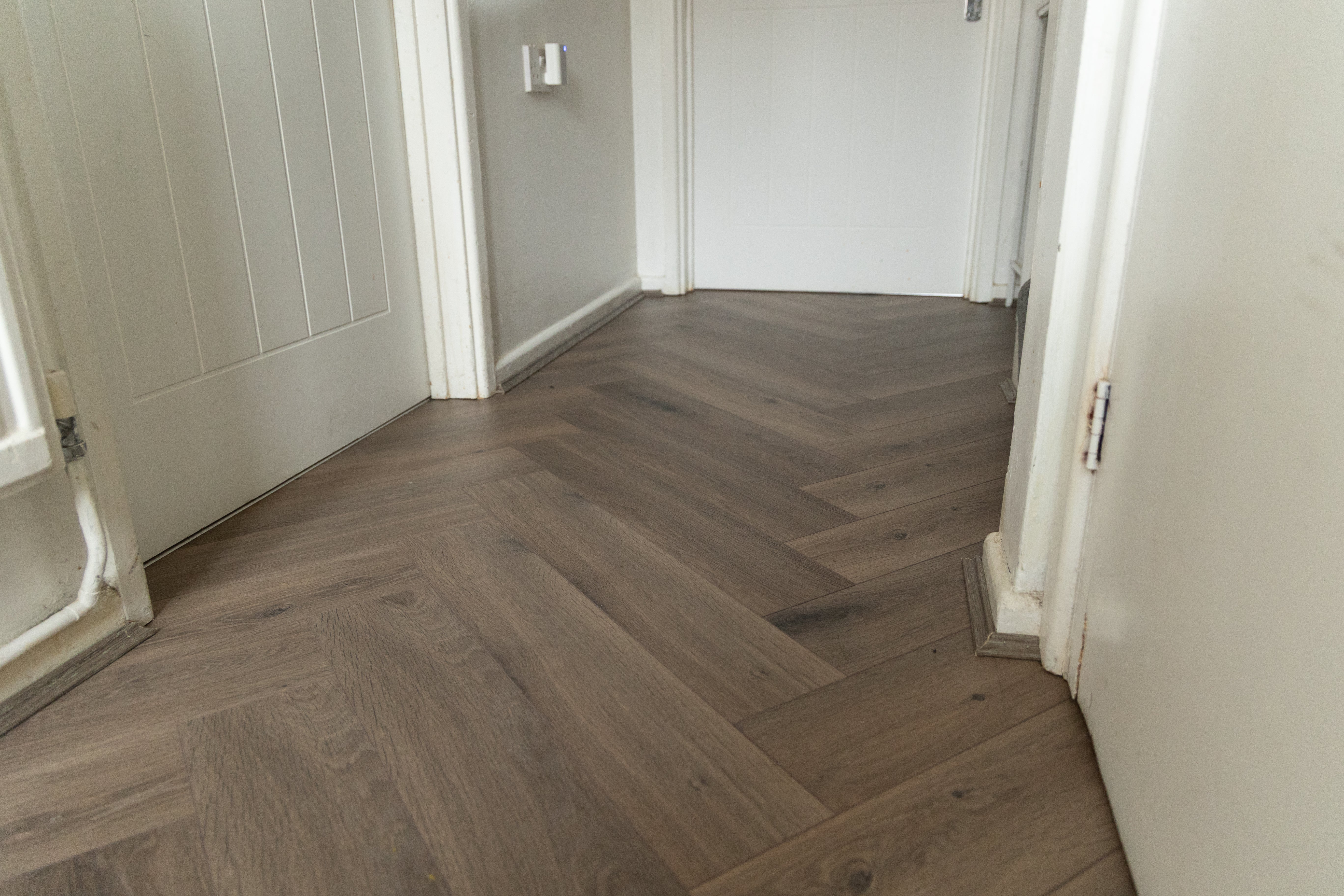 Forenzo Charcoal Trufflewood wide Herringbone Laminate Flooring - Image 4